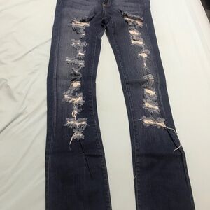Ripped Blue Jeans from Hot Topic